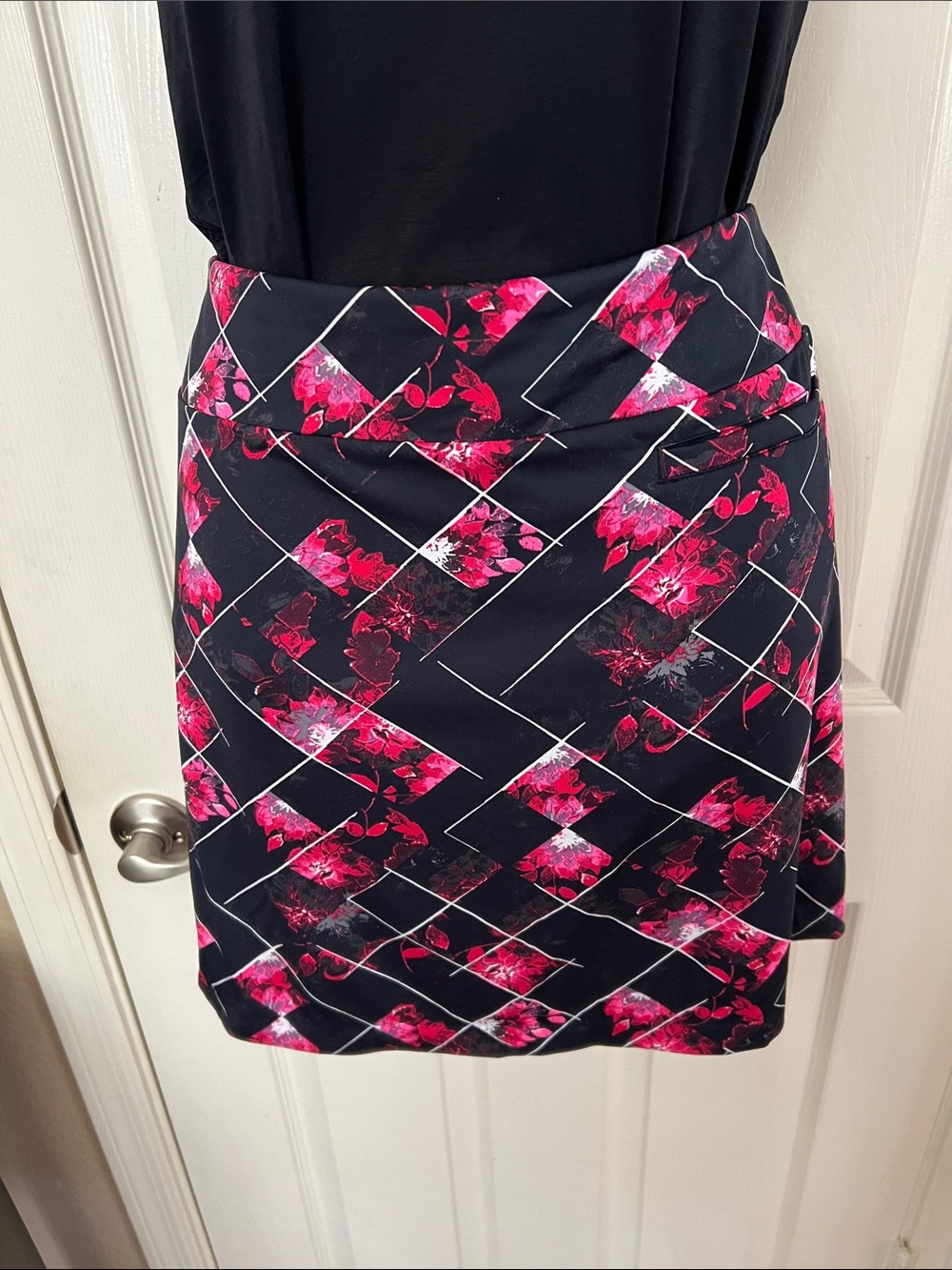 Tail Black Mini Golf Skirt with Fuchsia Floral Geometric Print